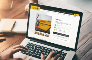 user making an online booking via towens bespoke skip hire page on a laptop