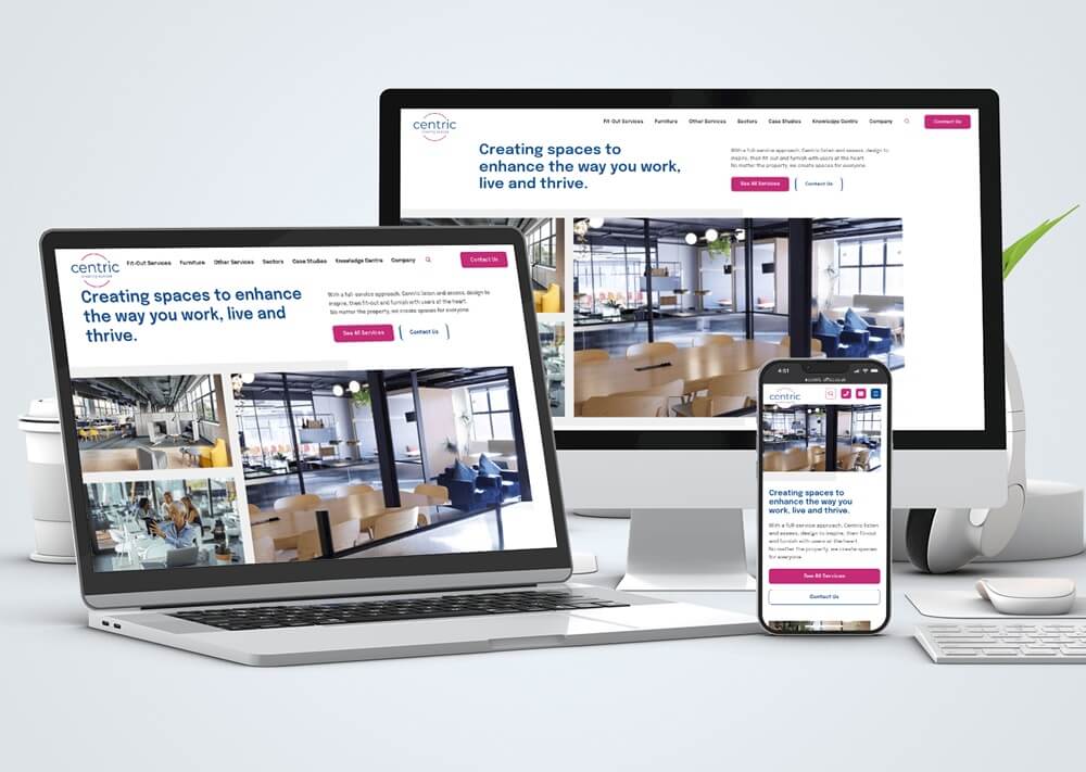 Three devices showing Centric interior design website with responsive layout - desktop monitor, laptop, and smartphone displaying consistent branding and modern office spaces