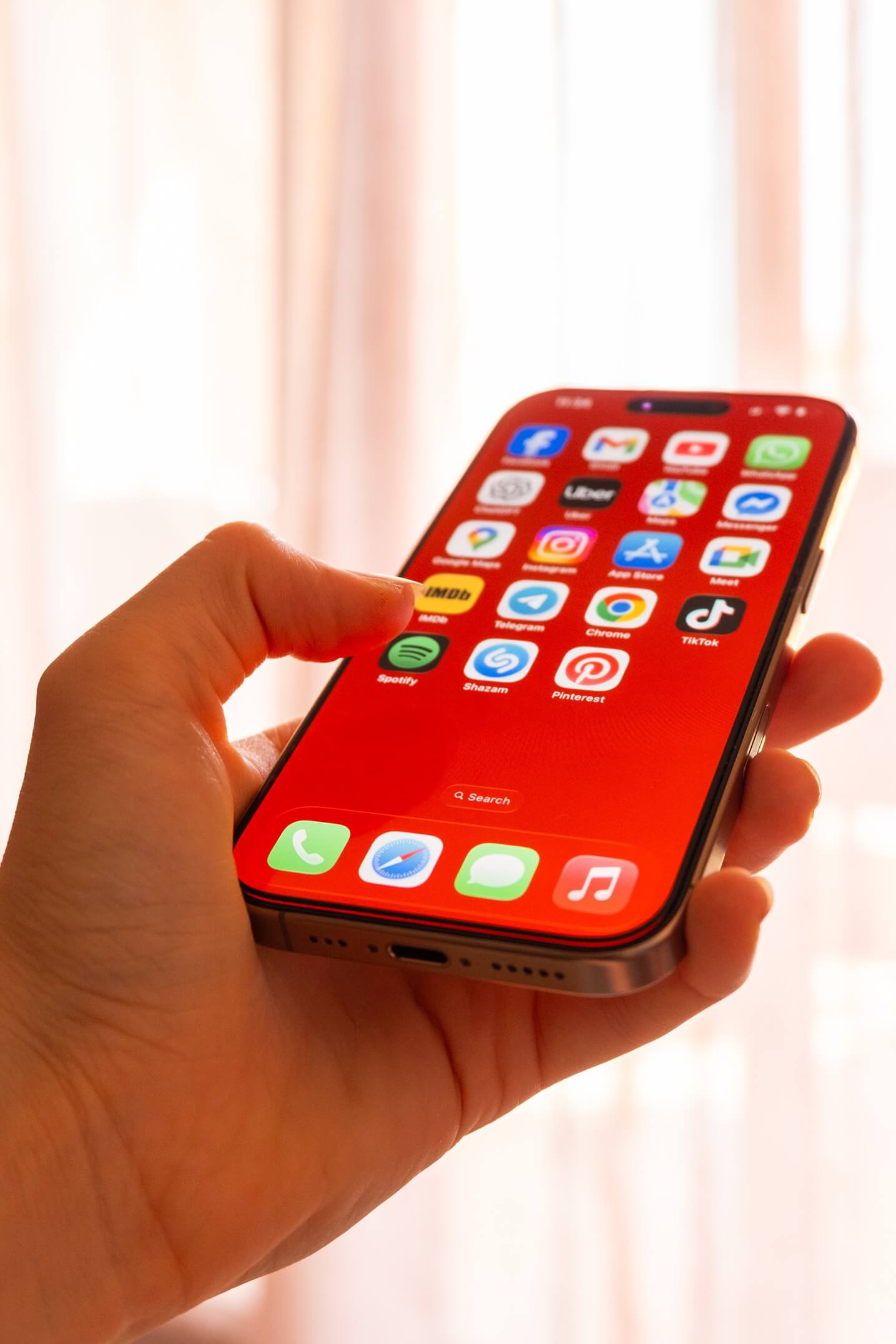 Social media marketing agency managing social media apps on a mobile phone