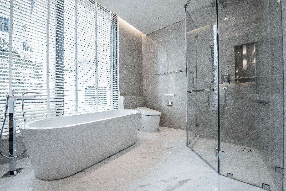 Modern bathroom with freestanding bath and glass walk-in shower