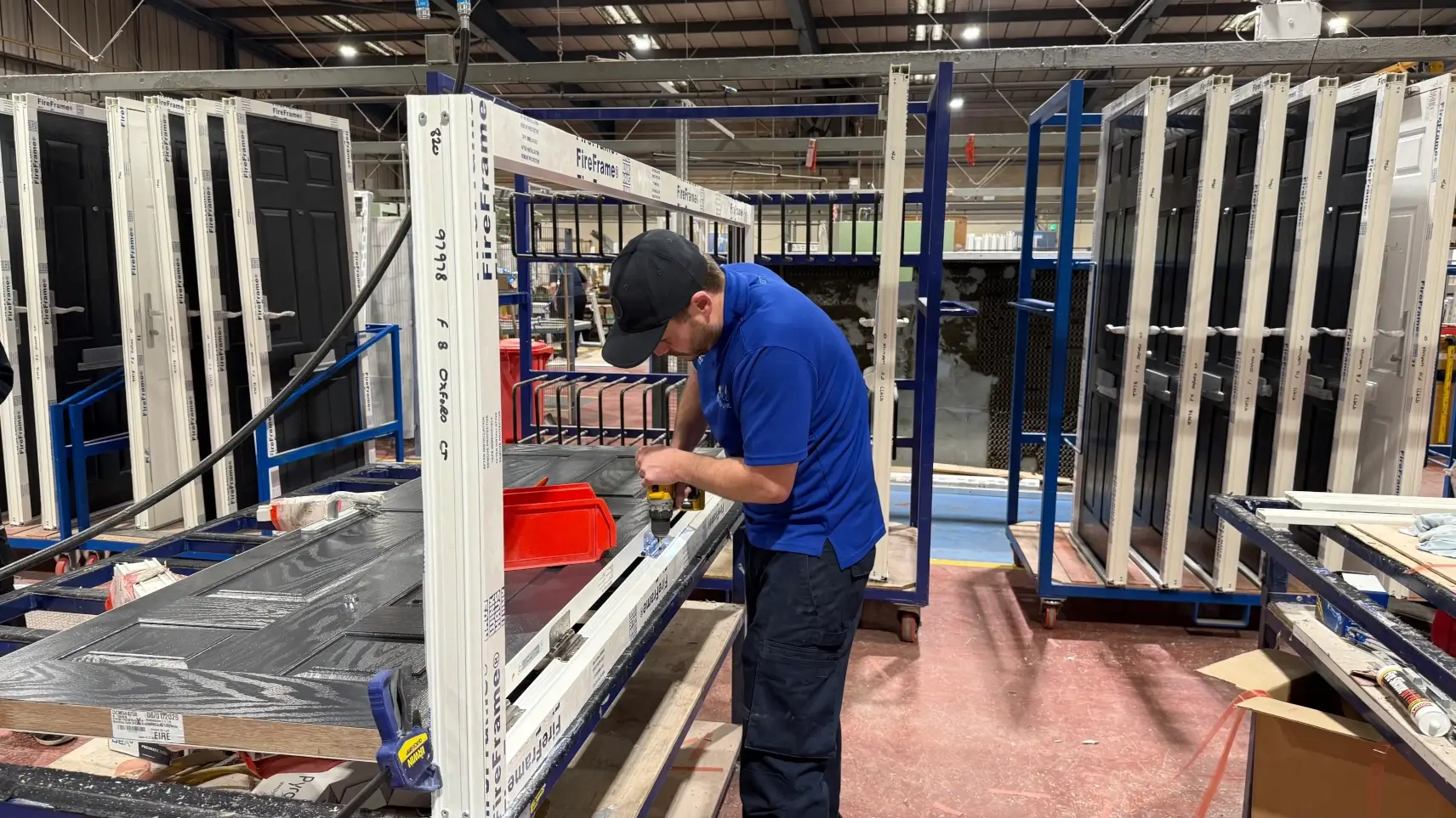 Fenestration marketing agency insight into door manufacturer assembling composite door in production facility