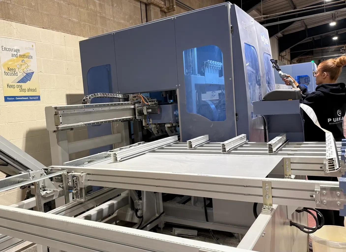 Fenestration marketing agency insight into window manufacturer operating fabrication machinery in production facility