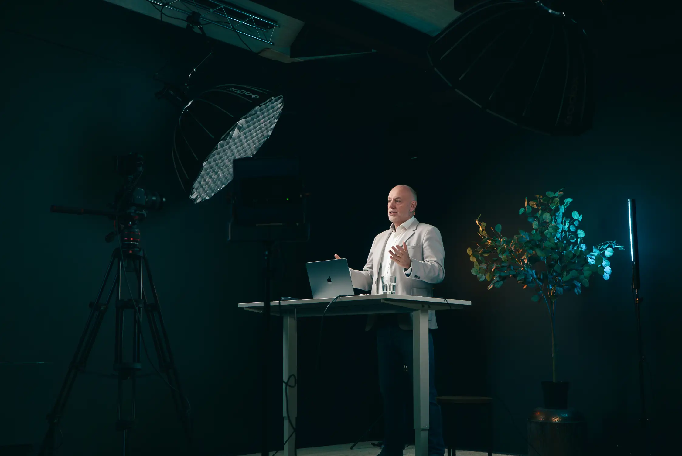 Andrew Scott presenting a glazing business growth webinar in a professional studio setting