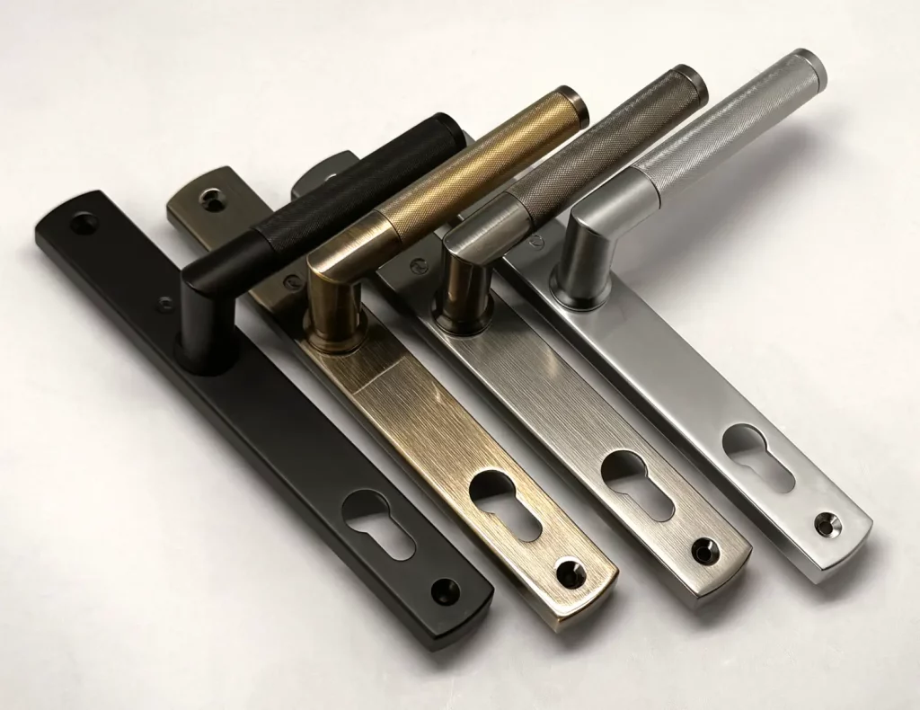 Architectural hardware marketing image showing Regal knurled door handle range by Window Ware in multiple finishes including black, brass, bronze and stainless steel.