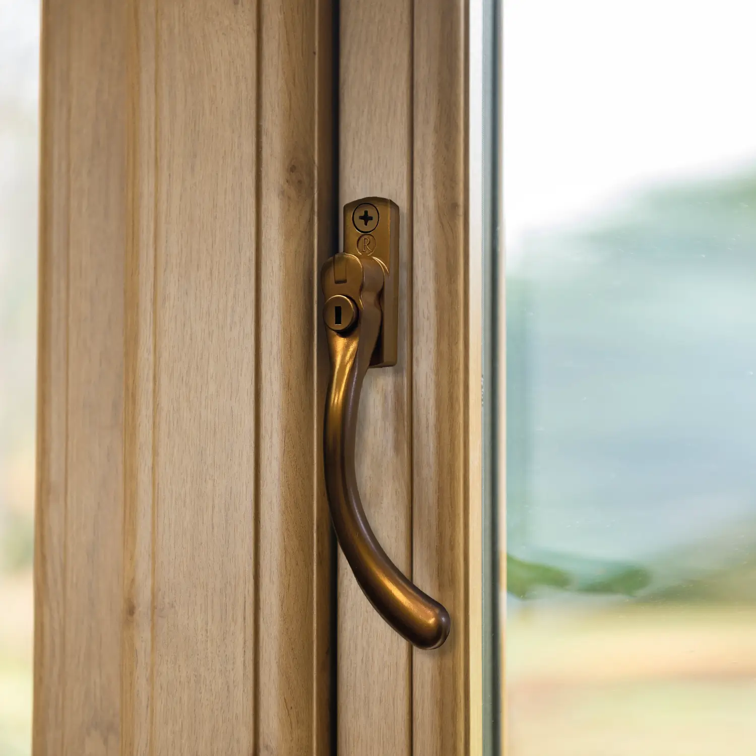 Architectural hardware marketing image showing the WW39 Regal Hardware MK2 window handle installed on a timber window frame.