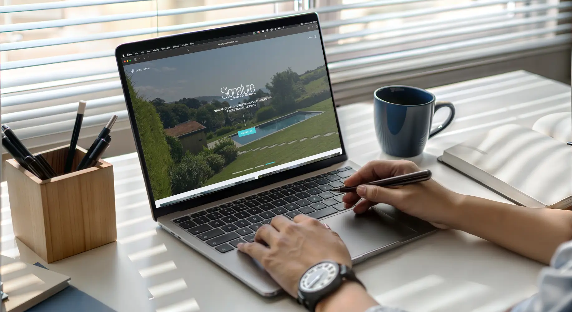 Outdoor living marketing website shown on laptop featuring pool and garden design project